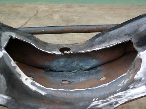 1976 Chevrolet Corvette - Close-up view of a modified Corvette frame section, showing cutouts and welding work.