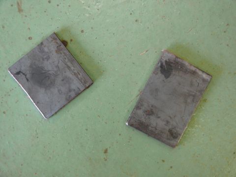 1976 Chevrolet Corvette - Two metal plates are shown on a green, speckled surface.