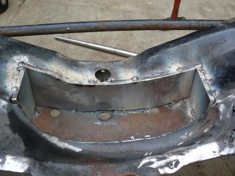 1976 Chevrolet Corvette - Close-up view of a modified Corvette C3 frame section, showing extensive welding and structural reinforcement.