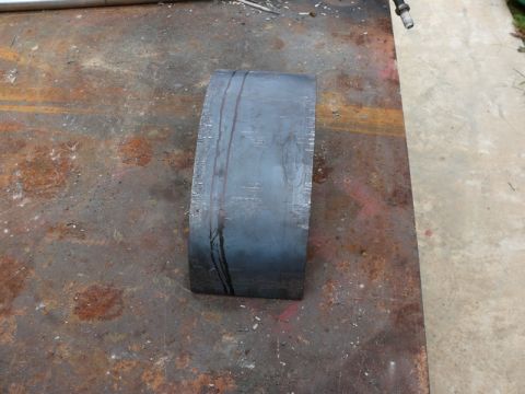 1976 Chevrolet Corvette - A metal part with scribe lines is shown on a workbench.