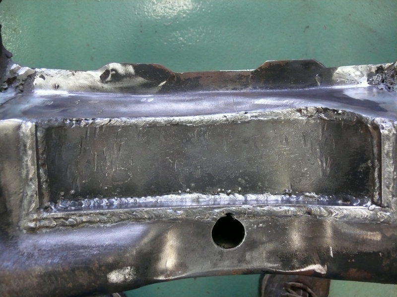 Welded frame section with visible text