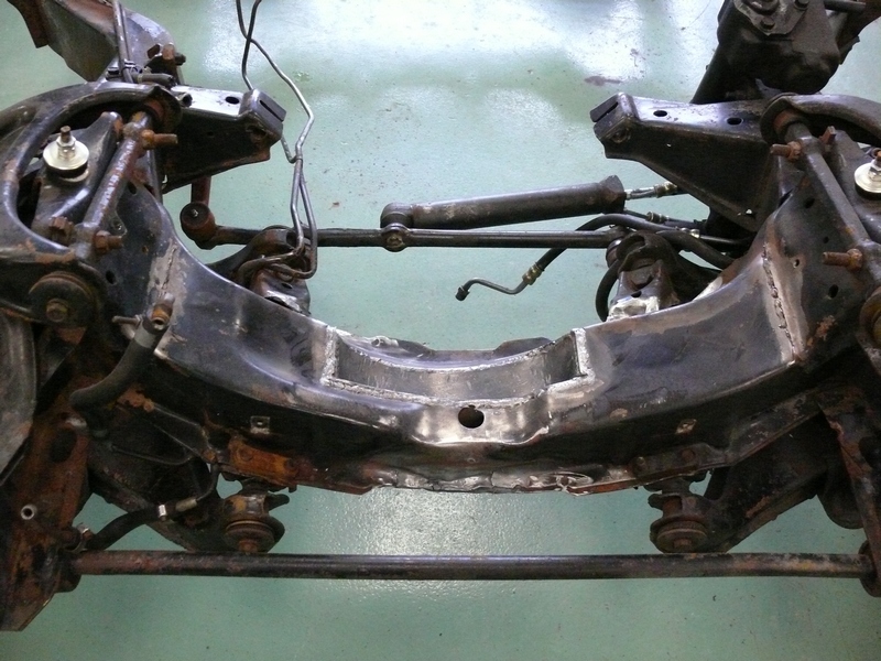 Front suspension subframe assembly with steering components attached