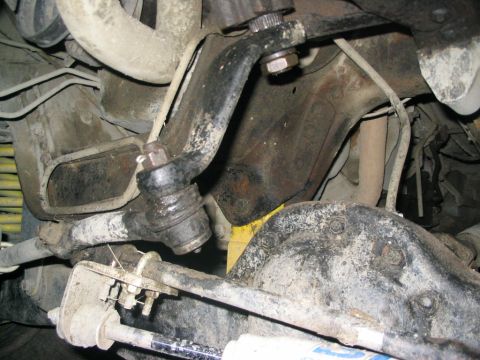 1986 Ford Bronco - Underside view of vehicle steering and suspension components, likely from an older truck or SUV.