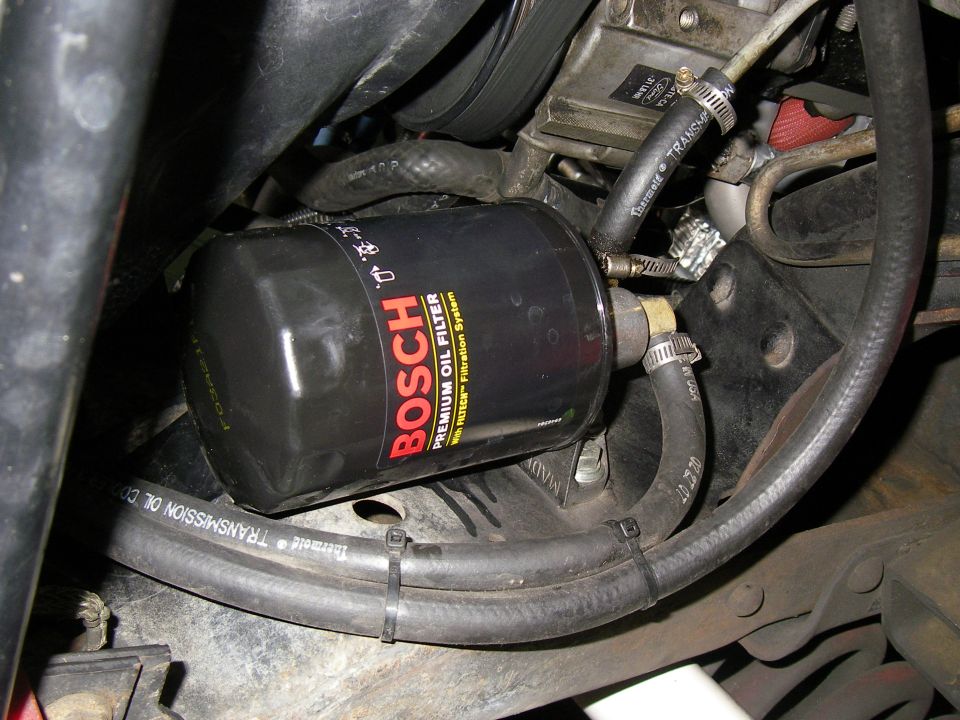 Close-up of a Bosch premium oil filter with transmission lines attached