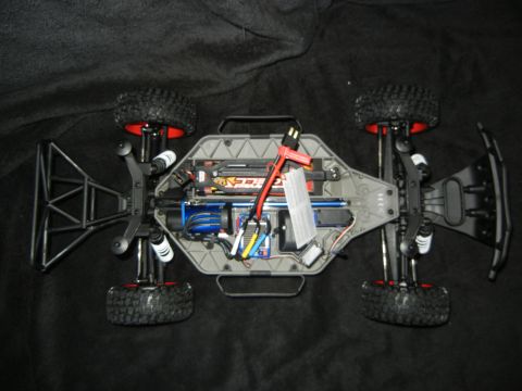 2011 Ford F-150 - The underside of a remote control car chassis reveals its internal components and wiring.