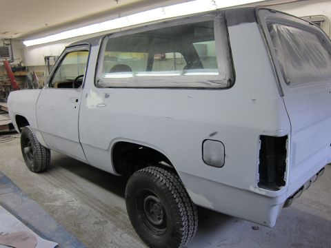 1987 Dodge 1500 - This 1987 Dodge 1500 SUV is shown in a garage, prepped for paintwork.