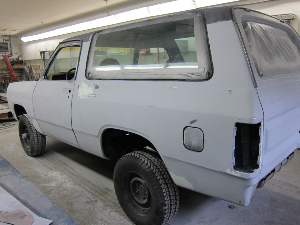 1987 Dodge 1500 SUV in primer, rear three-quarter view