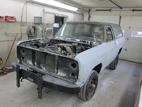 1987 Dodge 1500 - 1987 Dodge Ramcharger in body shop, hood open, showing engine and front end.