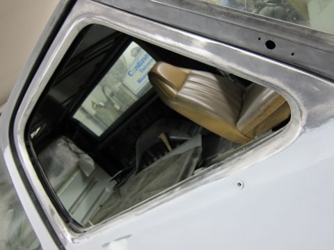 1987 Dodge 1500 - Interior view of a truck with tan seats, showing bodywork in progress.