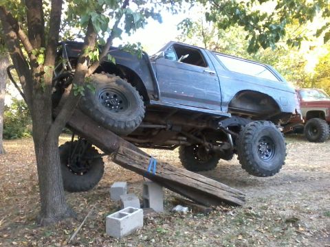 1986 Ford Bronco - This modified 1986 Ford Bronco is positioned on an obstacle course with logs and cinder blocks.