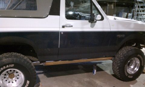 1979 Ford Bronco - This Ford Bronco features a two-tone paint scheme and large off-road tires.