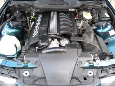 1998 BMW M3 - Engine bay of a 1998 BMW M3, showing the inline-six engine and surrounding components.