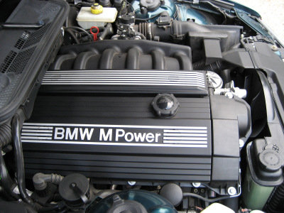 1998 BMW M3 - Close-up of a BMW M Power engine cover, showing the "BMW M Power" text.