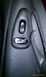 1994 Ford Probe - Interior door panel detail showing window controls and the door handle mechanism.