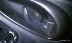 1994 Ford Probe - Close-up view of a car's door handle mechanism.