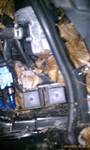 1994 Ford Probe - Close-up view of engine bay parts, including insulation and wiring.