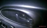 1994 Ford Probe - Close-up of a car's interior door handle and surrounding trim.