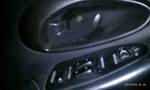 1994 Ford Probe - Car interior door panel showing window and lock controls.