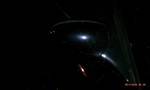 1994 Ford Probe - A close-up shot of a car's side mirror at night, reflecting light sources.