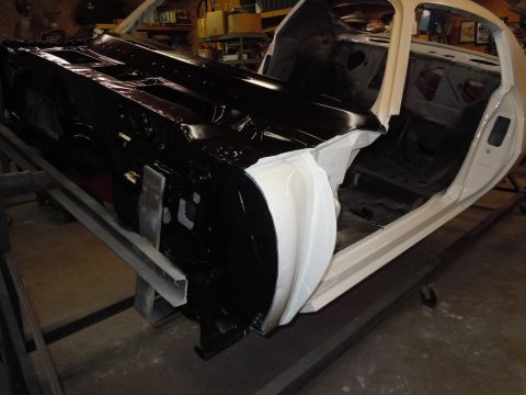 1973 Pontiac Trans Am - This car body is in the process of restoration, with one side painted black and the interior showing white primer.