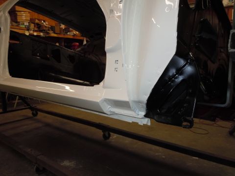 1973 Pontiac Trans Am - Car door frame and interior undergoing restoration or repair work.