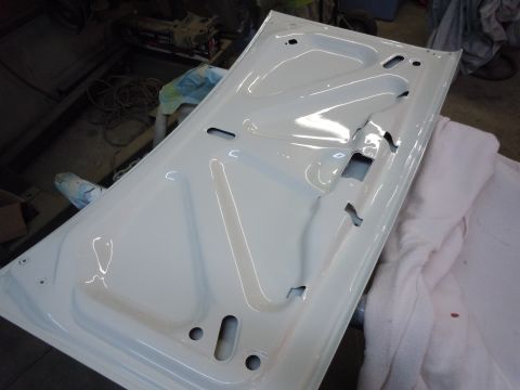 1973 Pontiac Trans Am - The interior of a white car door, showing stamped metal for reinforcement and mounting points.