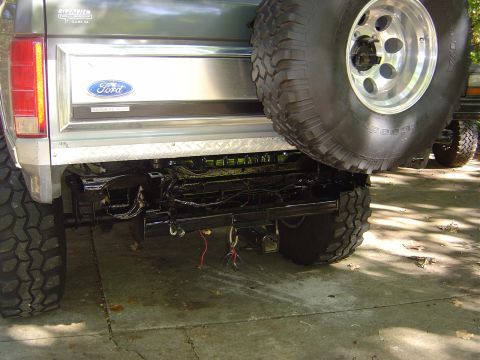 1986 Ford Bronco - Rear view of a 1986 Ford Bronco, showing the bumper, spare tire, and Ford badging.