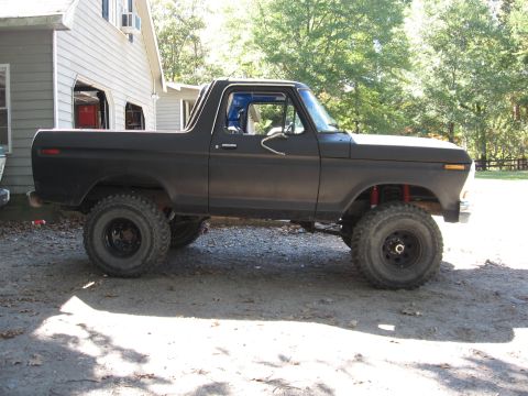 1978 Ford Bronco - This lifted 1978 Ford Bronco has a matte black finish and is viewed from the side.