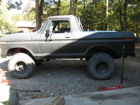1978 Ford Bronco - This lifted 1978 Ford Bronco is shown in a side profile, large off-road tires and a matte black finish.