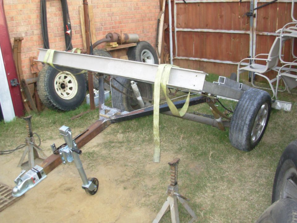 The tongue tilts on the front spring brackets.  The center of the deck is very slightly forward of the axle so it always has a tendency to fall forward onto the tongue.