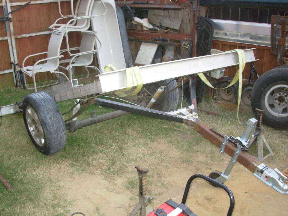 The tongue tilts on the front spring brackets.  The center of the deck is very slightly forward of the axle so it always has a tendency to fall forward onto the tongue.