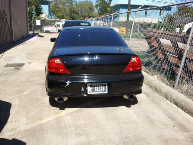 Black Acura CL sedan with a Texas license plate reading CLS36, parked outdoors