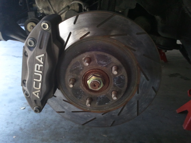 Acura brake caliper and slotted rotor