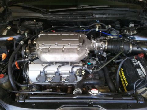 2008 Subaru Legacy - Close-up view of a car's engine bay, showing various components and a watermark.