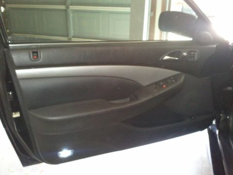 2008 Subaru Legacy - The interior door panel features a silver accent strip and power window controls.