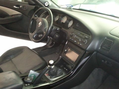 2008 Subaru Legacy - Interior view of a car's dashboard, steering wheel, and seats.