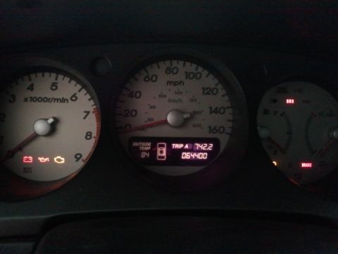2008 Subaru Legacy - The dashboard displays the outside temperature, trip mileage, and odometer reading.