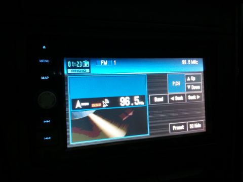 2008 Subaru Legacy - Car radio display shows FM 1 station 96.5 MHz and time 01:23.