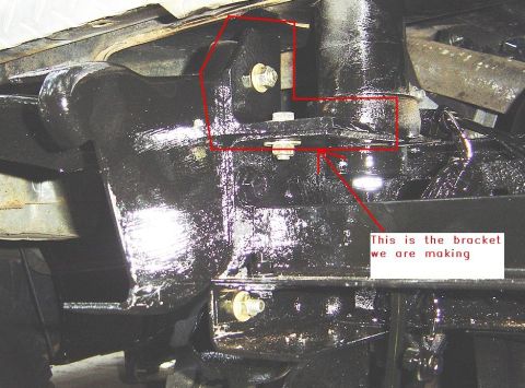 1986 Ford Bronco - Close-up view of a custom-fabricated rear bumper bracket, highlighted with a red outline.