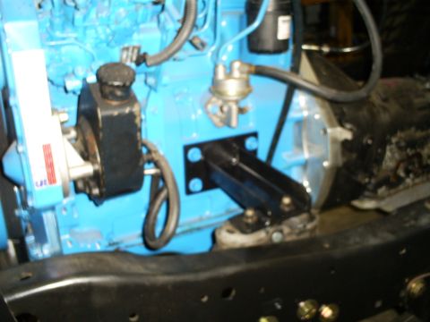 1992 Ford Bronco - Engine components including a power steering pump and fuel pump are visible in this close-up view.