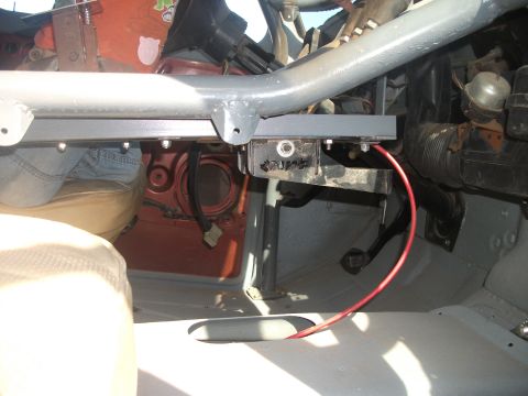 1979 Ford Bronco - The interior of a 1979 Ford Bronco shows a custom roll cage installed around the dashboard and seating area.