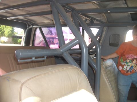 1979 Ford Bronco - Vehicle interior modified with a custom grey roll cage structure.