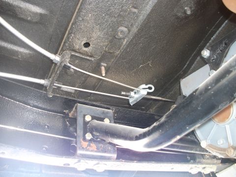 1979 Ford Bronco - Underside view shows the parking brake cables and linkage system, but the specific vehicle year cannot be determined from this angle.