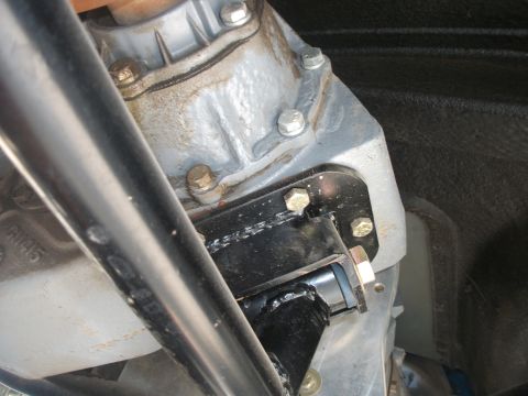 1979 Ford Bronco - Custom bracket for an NP203 transfer case doubler is bolted to the transmission housing.