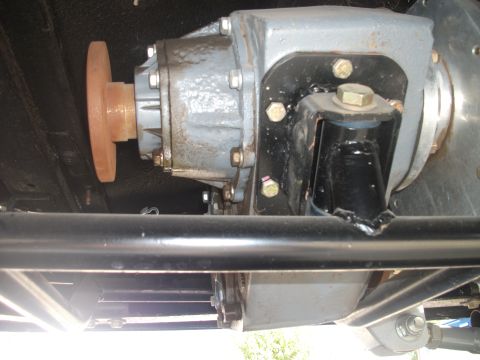 1979 Ford Bronco - Underside view of vehicle drivetrain components, including a transfer case and driveshaft parts.