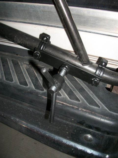 1996 Ford Bronco - This is a close-up view of a trailer hitch receiver, showing its mounting hardware and adjustment mechanism.
