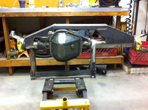 Suzuki Samurai - A custom-fabricated front axle assembly is shown, likely for off-road modification.