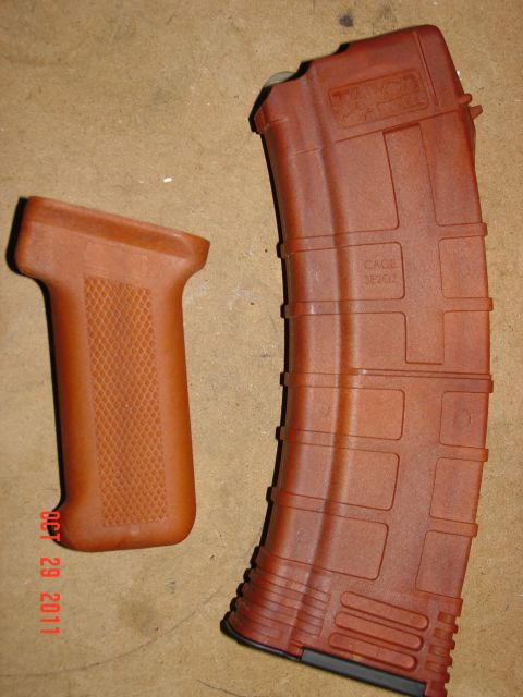 2000 Ford Crown Victoria - AK-47 magazine and pistol grip shown with a date stamp and website URL.