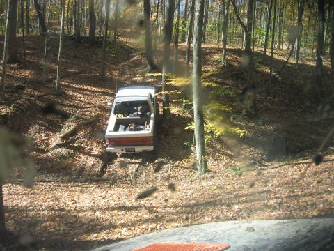 1987 Jeep Comanche - A 1987 Jeep Comanche navigates a wooded trail during an off-road excursion.