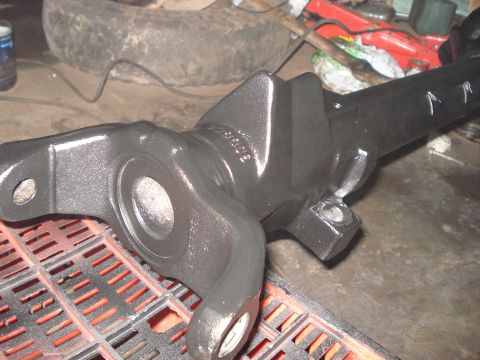 1980 Ford Bronco - Close-up of a painted steering knuckle assembly, likely for a 4x4 vehicle.